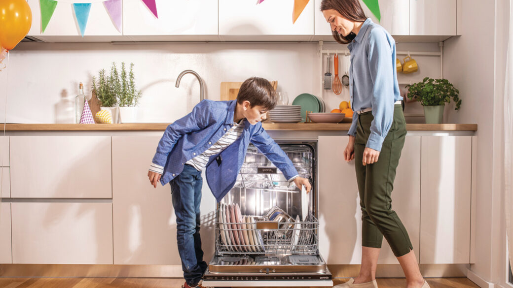Mother and son unloading Gorenje dishwasher