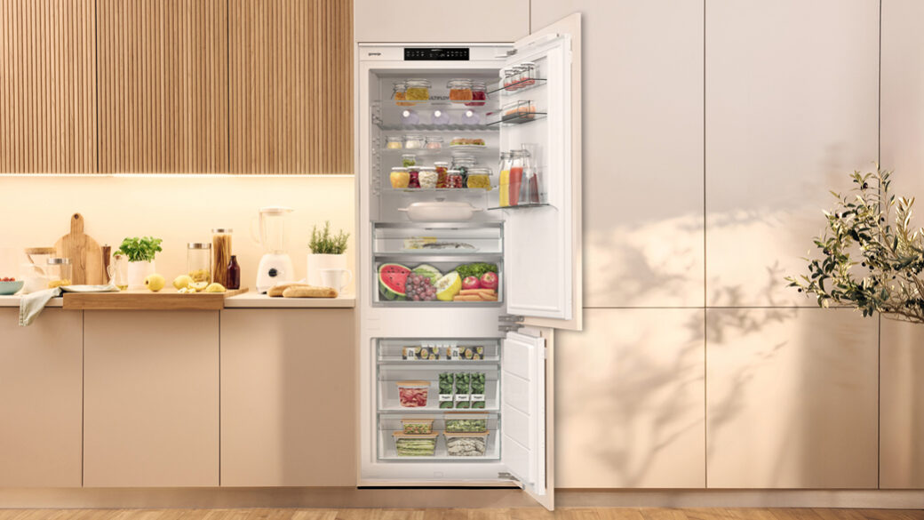 Open built in refrigerator in an elegant bright kitchen